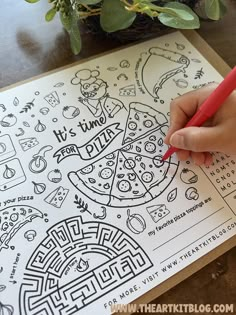 a person is writing on a piece of paper with a red pen and some plants in the background