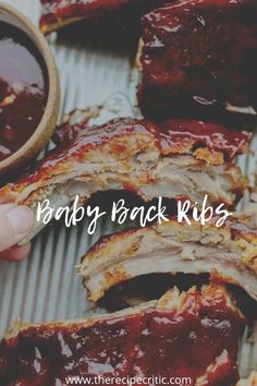 baby back ribs with bbq sauce on the side and text overlay that reads, baby back ribs