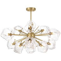 a chandelier with clear glass balls hanging from it's golden metal frame