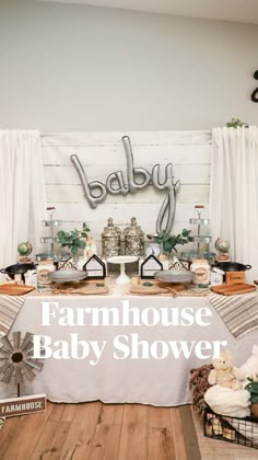 a baby shower is set up with farm animals and other items on the table, along with a sign that says farmhouse baby shower