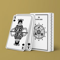 two playing cards, one in white and the other in black