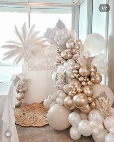 a table topped with balloons and other decorations