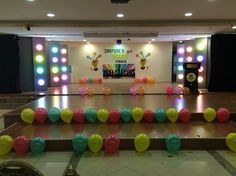 an empty dance floor with balloons on it