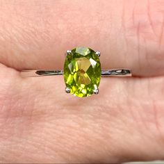 Genuine 1 Carat Peridot Oval Solitaire ~August Birthstone Ring ~ Dainty Engagement / Minimalist Fashion New! Retail Price: $119 Metal: Solid 925 Sterling Silver Finish: High Polish Hallmark: Stamped 925 Stone: Natural Peridot Stone Size: 8x6mm Stone Weight: 1.16 Carats Stone Shape: Oval Multiple Sizes Available August Birthstone Gift Box & Jewelry Cleaning Cloth Included! Perfect Genuine Gemstone Solitaire Ring! Dainty Ring Is A Perfect Everyday Fashion Or Trendy Engagement Ring! The Oval Shaped Classic Lime Green Oval Jewelry, Oval Peridot Gemstones For Anniversary, Oval Green Gemstone Birthstone Ring, Oval Lime Green Ring For Gift, Oval Lime Green Rings For Anniversary, Lime Green Oval Jewelry For May Birthstone, Lime Green Oval Rings For Anniversary, Lime Green Oval Rings With Accent Stones, Oval Lime Green Anniversary Ring