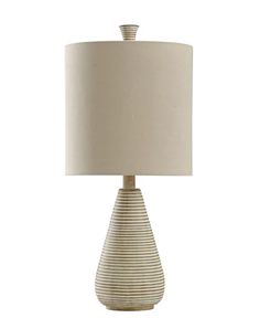 a table lamp with a white shade on it and a beige striped lampshade