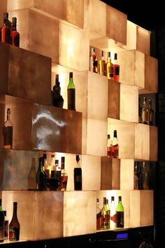 several bottles are lined up on the wall