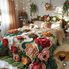 a bed covered in lots of flowers next to a window