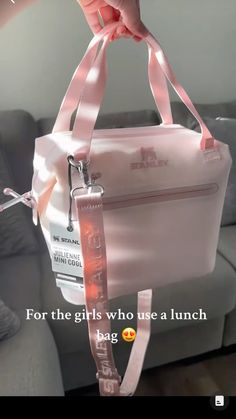 a person is holding a pink bag in their hand and it says, for the girls who use a lunch bag