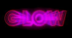 the word wow is lit up in pink and purple light, with an abstract effect