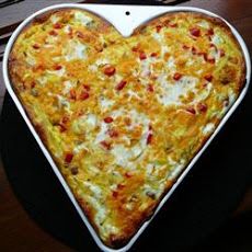 a heart shaped pizza sitting on top of a table