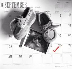 a pair of shoes sitting on top of a calendar