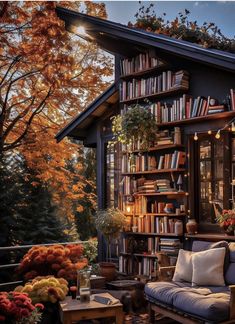 a room filled with lots of books and furniture