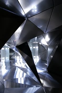 an abstract metal sculpture in the middle of a room