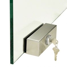 a glass door with a key attached to it