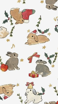 an image of rabbits and christmas decorations on white paper with stars, holly leaves and bells