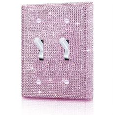 a pink light switch cover with two lights