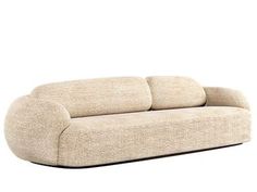 a beige couch sitting on top of a white floor