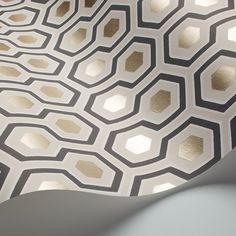 an abstract wallpaper with hexagonal shapes in gold and grey colors, on a white background