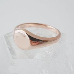 A miniature, sweet signet ring in a slim band with a flat, blank top. Our materials make for an amazing, high quality, seamless, jewelry piece with longevity. Our rings are plated with 18k gold, 18k rose gold, or sterling silver and finished with a protective coating. A little secret we’ll keep between us: it looks way more than it costs. Need help finding your ring size? See our printable ring size chart. Modern Rose Gold Dome Ring With Polished Finish, Formal Rose Gold Jewelry With Smooth Bezel, Modern Oval Rose Gold Rings, Modern Rose Gold Oval Rings, Classic Rose Gold Signet Ring Stamped 14k, Minimalist Hallmarked Dome Ring With Round Band, Classic Rose Gold Stackable Open Rings, 14k Rose Gold Open Engraved Ring, 14k Rose Gold Open Dome Ring