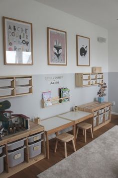 there is a room with several children's desks and toys on the wall