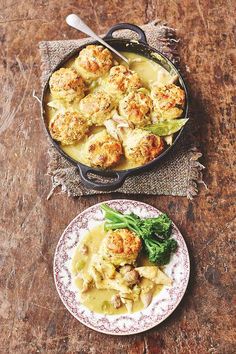 a pan filled with meatballs and broccoli covered in gravy on top of a wooden table