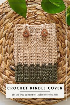 the crochet kindle cover is sitting on top of a wicker basket