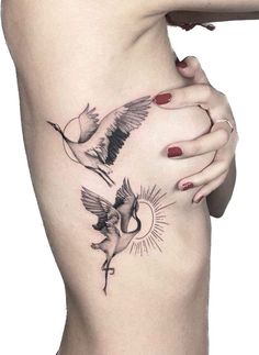 a woman's stomach with two birds on it