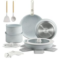 an assortment of kitchen accessories including pots and pans