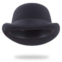 PRICES MAY VARY. Timeless Elegance: The black bowler hat, also known as the derby hat, boasts a history that dates back to the mid-19th century. Originating in England, it was designed to be a hat that provided both style and protection for the head. Over the years, it has evolved into a symbol of classic elegance. This particular model stays true to the essence of that design with its rounded crown and narrow brim. High-Quality Craftsmanship: Our black derby bowler hat is meticulously crafted f Black Bowler Hat, Bowler Hat, Derby Hat, Felt Wool, Black Felt, Derby Hats, Hat For Man, Hat Shop, Contemporary Fashion