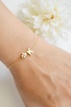 Super Dainty Personalized Cherry Blossom initial bracelet.▶ Material - Gold plated over brass▶ Chain Length - 5 ~ 9 inches adjustable▶ Measure - Flower 6mm  Letter H 7mm x W. 5mm▶The matching necklace available from following link.https://www.etsy.com/listing/558720665/personalized-cherry-blossom-initia▶The matching earrings available from following link.https://www.etsy.com/listing/558720665/personalized-cherry-blossom-initial▶ The jewelry comes in a gift box** Please check the shop policy for Flower Girl Bracelet, Dainty Flower Shaped Personalized Bracelets, Pink Initials Jewelry As A Gift, Pink Initials Jewelry Gift, Delicate Personalized Name Bracelet As A Gift, Personalized Delicate Name Bracelet As A Gift, Delicate Personalized Name Bracelet As Gift, Delicate Personalized Name Bracelet For Gift, Dainty Name Bracelet With Initials As Gift