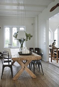 a wooden table sitting in the middle of a room