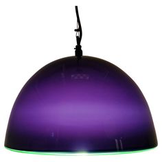 a purple light hanging from a ceiling fixture