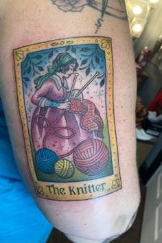 a woman with a knitting needle and ball of yarn on her arm