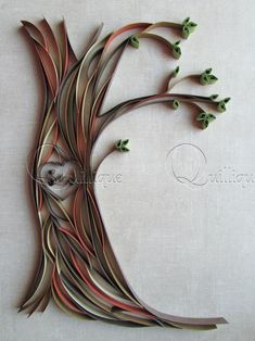 this is an image of a tree made out of metal and wood strips with leaves