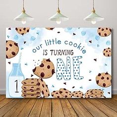 a sign that says, our little cookie is turning 1 and has chocolate chip cookies on it