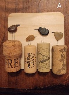 three wine corks with birds sitting on them