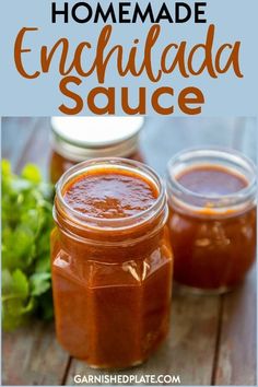 homemade enchilada sauce in jars on a wooden table