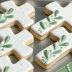 decorated cookies in the shape of letters with leaves on them