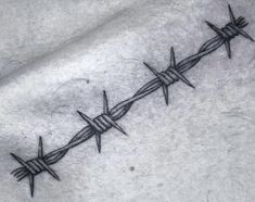 a barbed wire tattoo on the chest