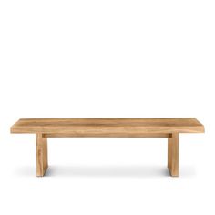 a wooden bench sitting on top of a white floor