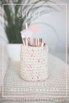 a crocheted basket with brushes in it