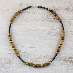 Warm colors make this necklace a brilliant piece of design. Matta showcases honeyed tiger's eye and brown pearls on a strand of onyx beads. .925 Sterling silver clasp Flying Tiger Pearl Necklace, Tiger Pearl Necklace, Brown Pearls, Tiger Eye Jewelry, Tigers Eye Necklace, Tiger Eye Beads, Onyx Bead, Tigers Eye, Tiger's Eye