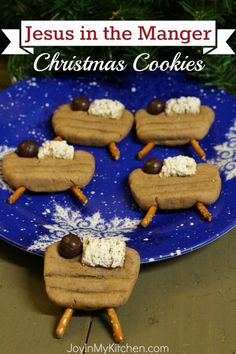 christmas cookies on a plate with marshmallows and pretzels in the middle