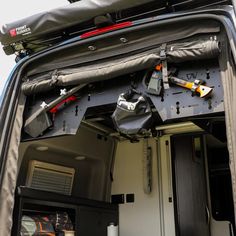 the back end of a van with various items in it