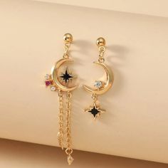 This Lovely Boho Pair Of Mismatched Celestial Crescent Moon And Eight Point Star Dangle Earrings Is A Wonderful Addition To Your Wardrobe And Your Style! This Unique Pair Is Sure To Get Lots Of Compliments! Dangling Star Earrings, Eight Point Star, Moon Earrings Studs, Star Dangle Earrings, Reality Shifting, Boho Drop Earrings, Flower Resin Jewelry, Earthy Style, Moon And Star Earrings