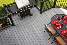 an overhead view of a patio with grills and chairs