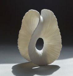 a white sculpture sitting on top of a table