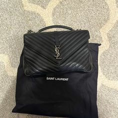 Excellent Condition. Black With Rhodium Hardware. Top Handle And Shoulder Strap. Back Pocket. Includes Dust Bag And Tag. Authentic Purchased From Neiman Marcus. See Last Photo Was Measurement Details. Ysl College, Yves Saint Laurent Bags, Neiman Marcus, Yves Saint Laurent, Dust Bag, Shoulder Strap, Saint Laurent, Bag Lady, Shoulder Bag