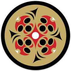 a black and gold circle with red designs on the center, surrounded by white dots