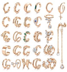 a collection of different types of rings and earrings on a white background with the letter c in